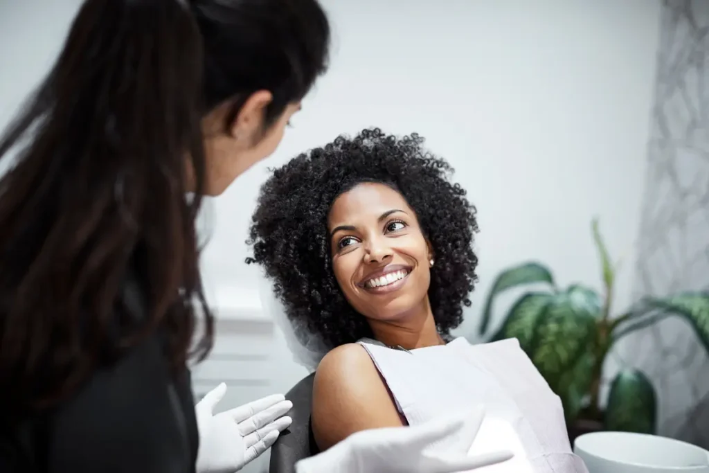 woman smiling at the dentist